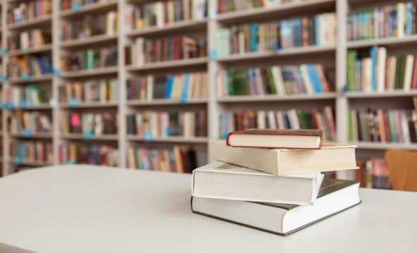 Pile Of Books On The Table At The Library